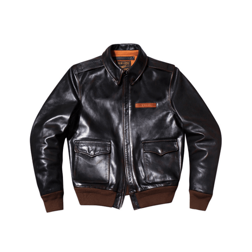 A black leather aviator jacket with brown ribbed trim at the hem, cuffs, and collar, featuring a zippered front, two flap chest pockets, and a small brown leather brand patch on the left chest.